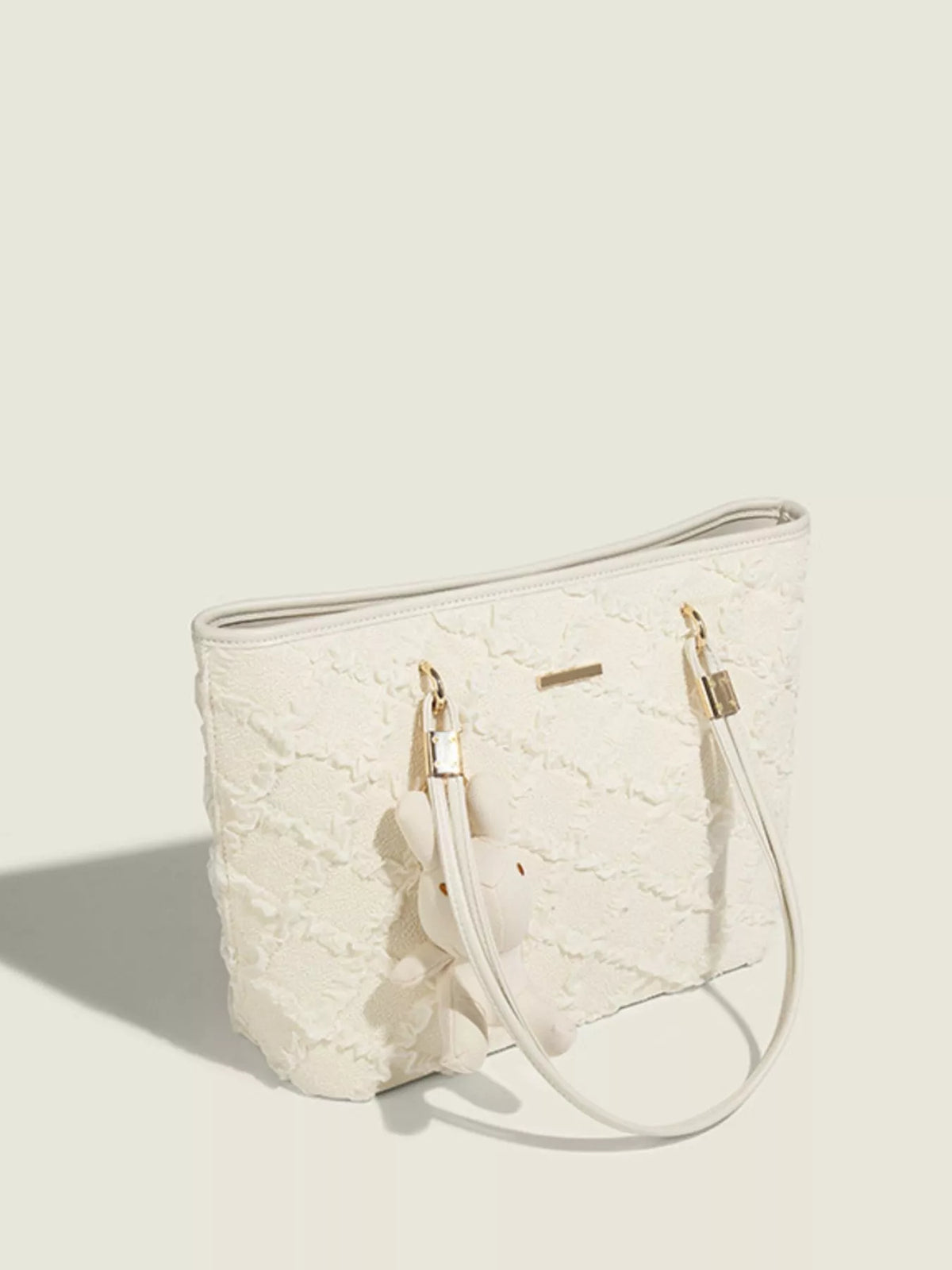 Textured tote bag carried on the shoulder