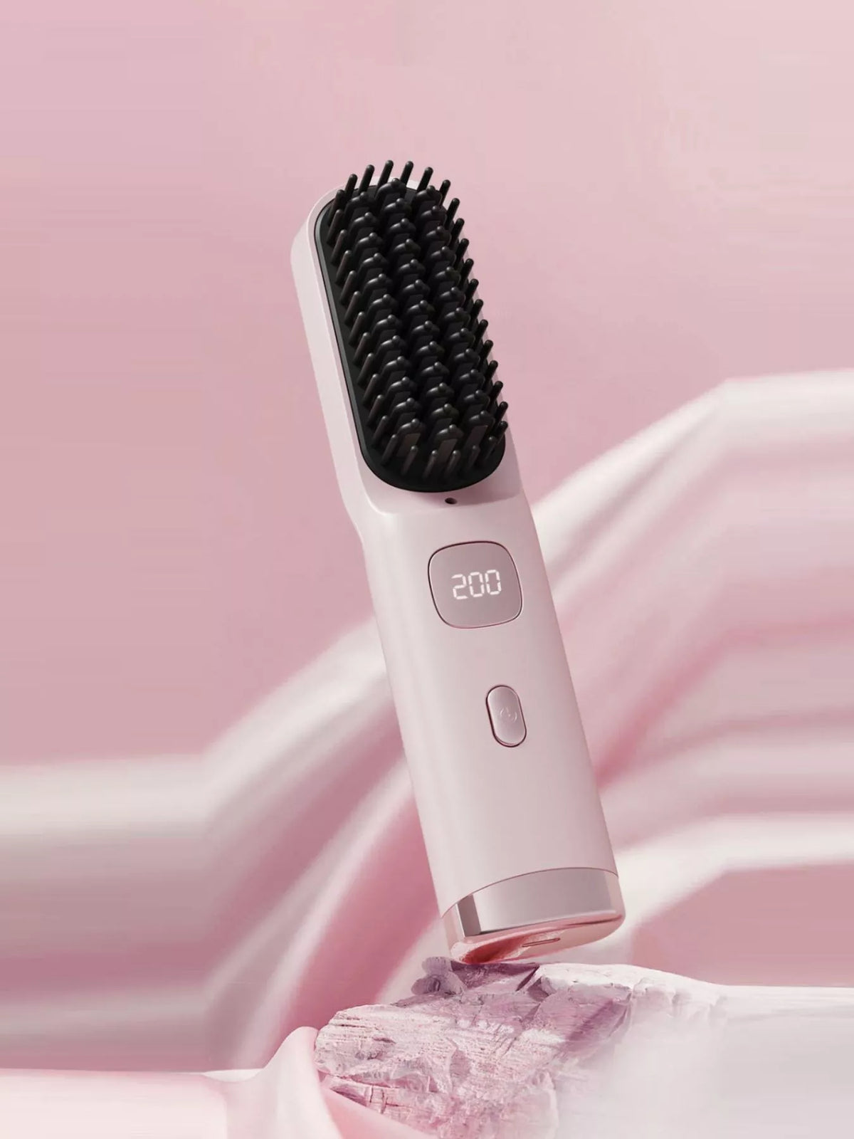 Heated comb held in hand