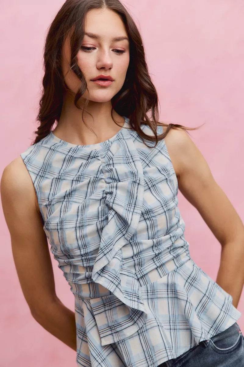 Blue plaid sleeveless ruffle peplum top front view