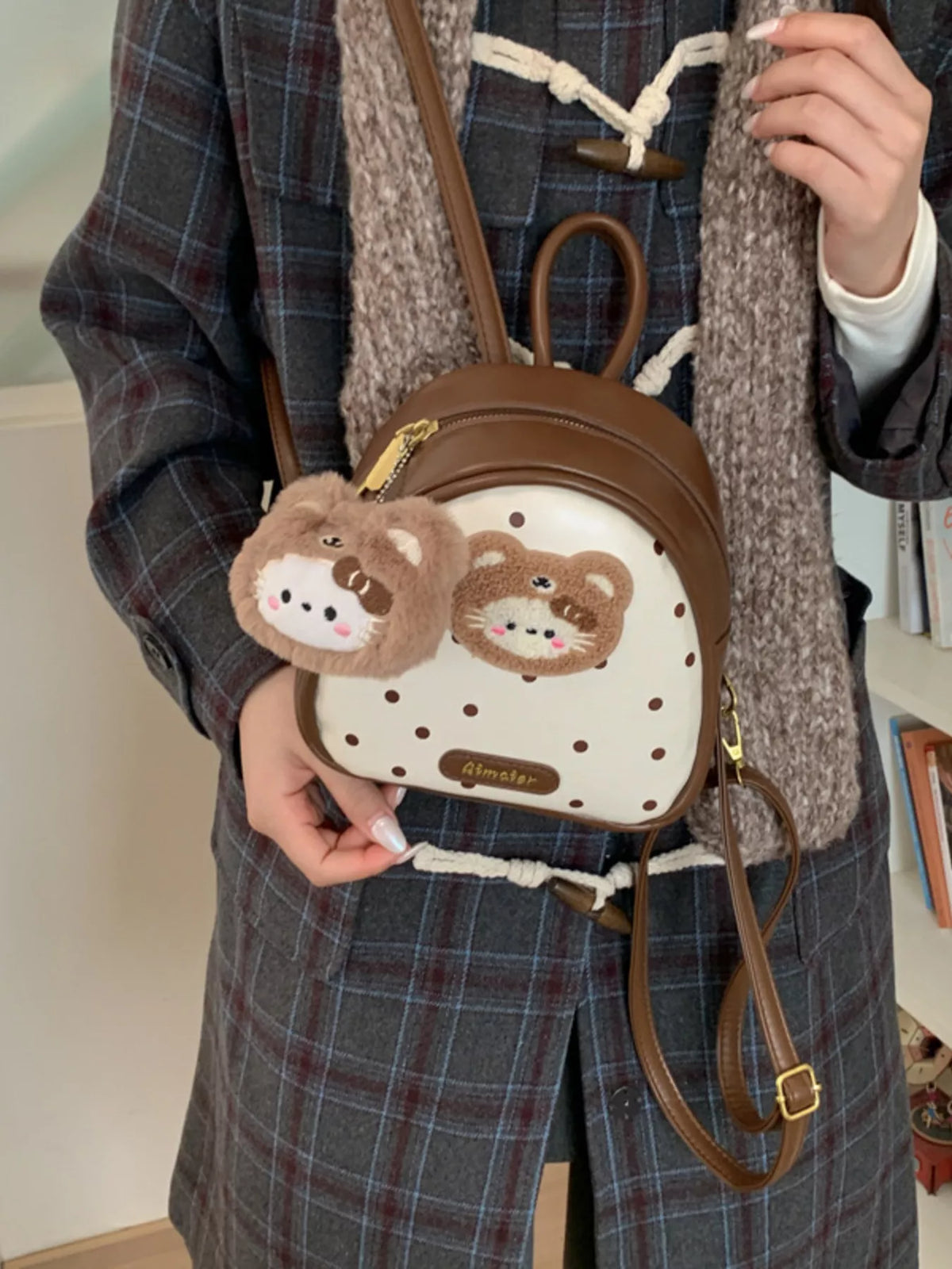 Brown cartoon bear mini backpack shoulder strap detail