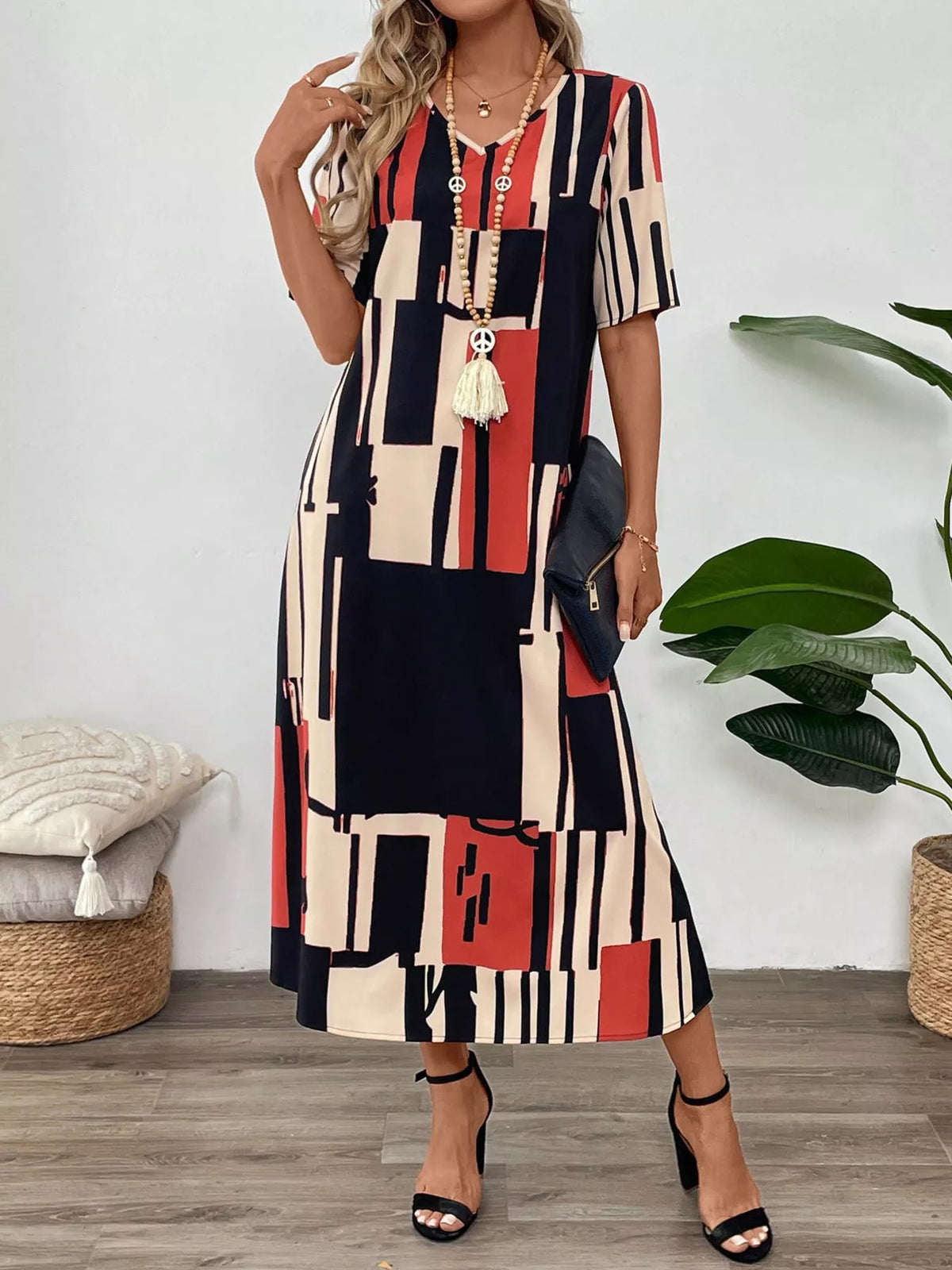Abstract geometric print v neck midi dress detail view