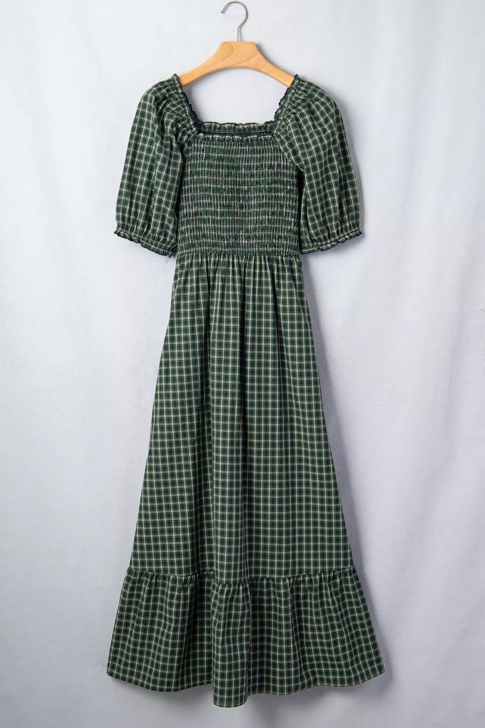 Side view showing the full skirt of the maxi dress