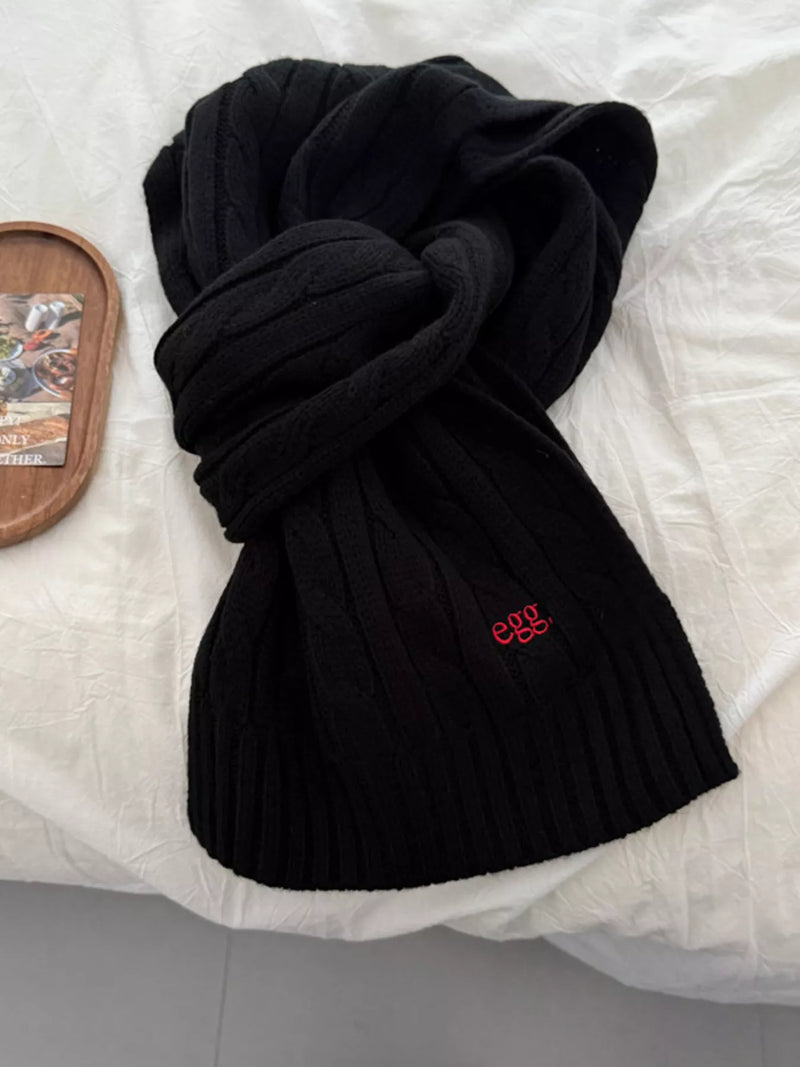 Ribbed knitted winter scarf shown at full length