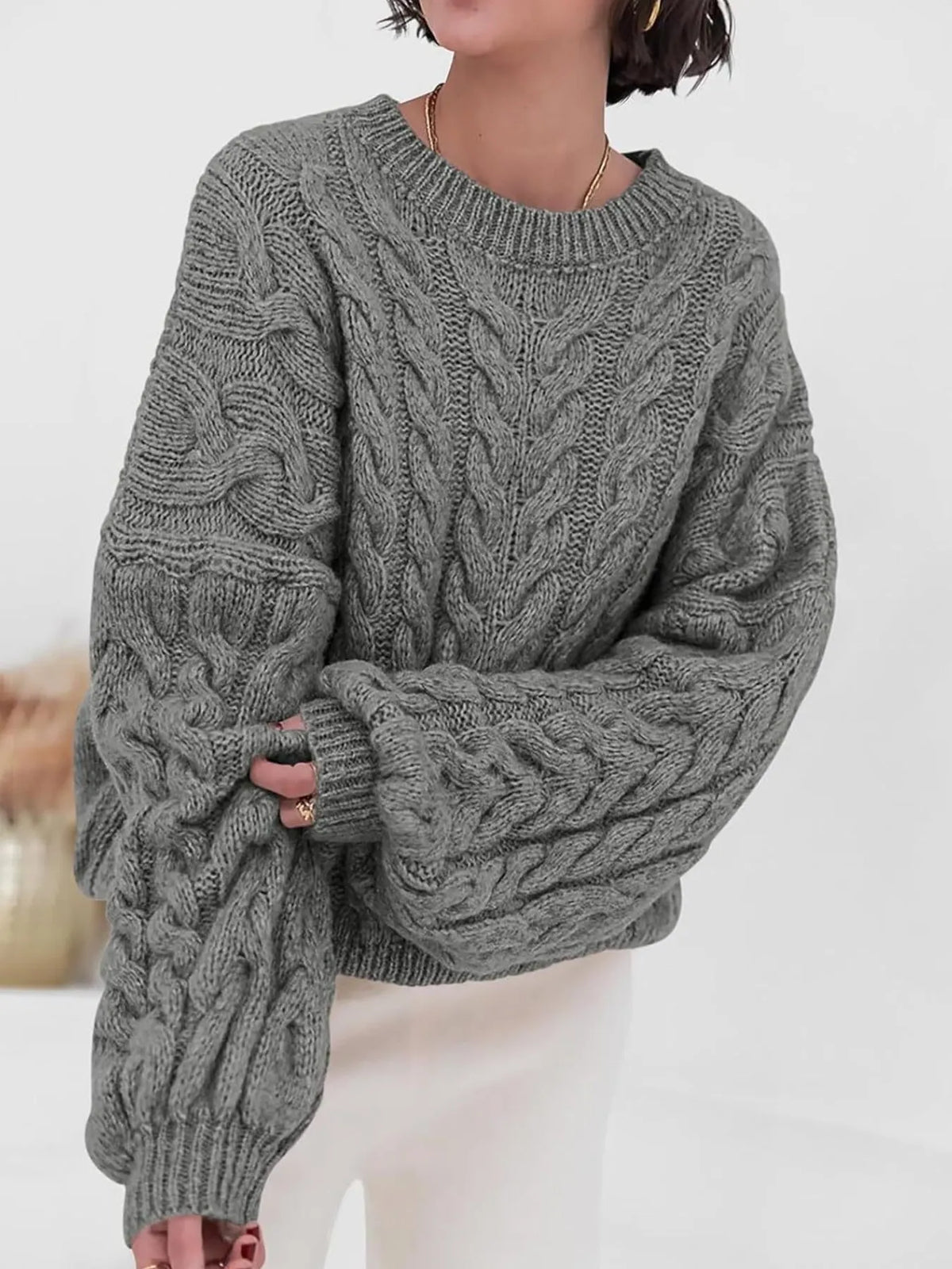 cable knit long sleeve sweater side view
