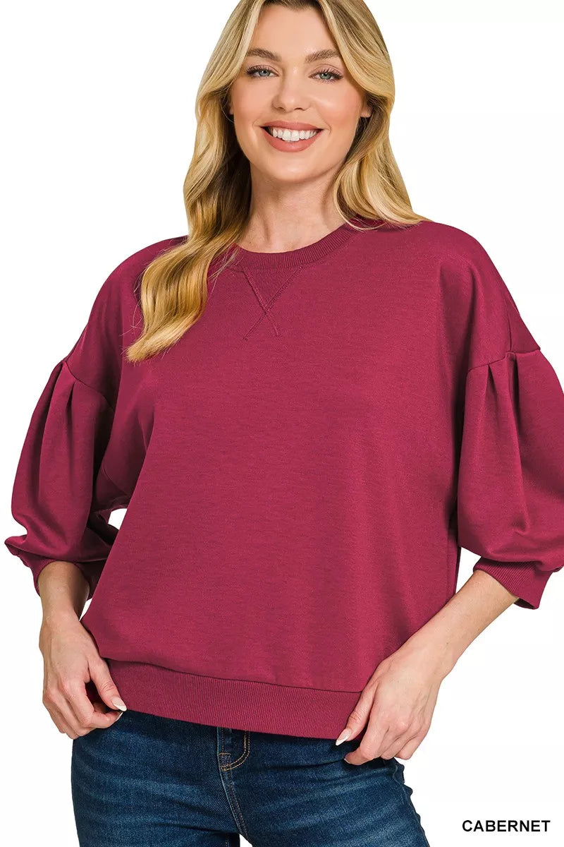 Model wearing the Zenana scuba dolman sleeve sweatshirt in a front view