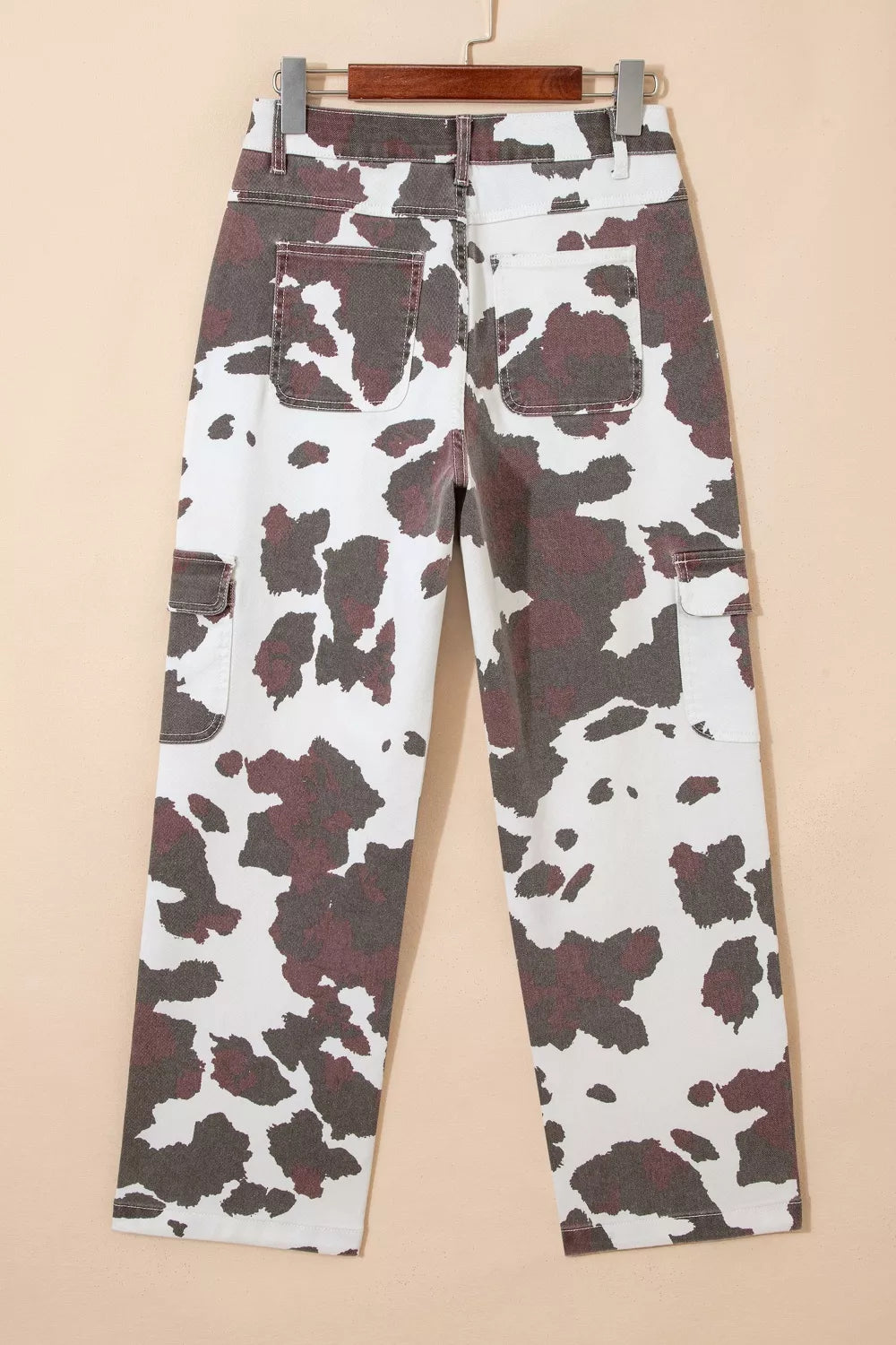 Back view of cow print multi pocket jeans