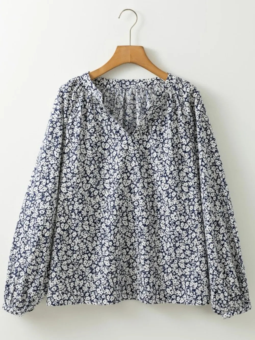 Floral print detail on blouse fabric