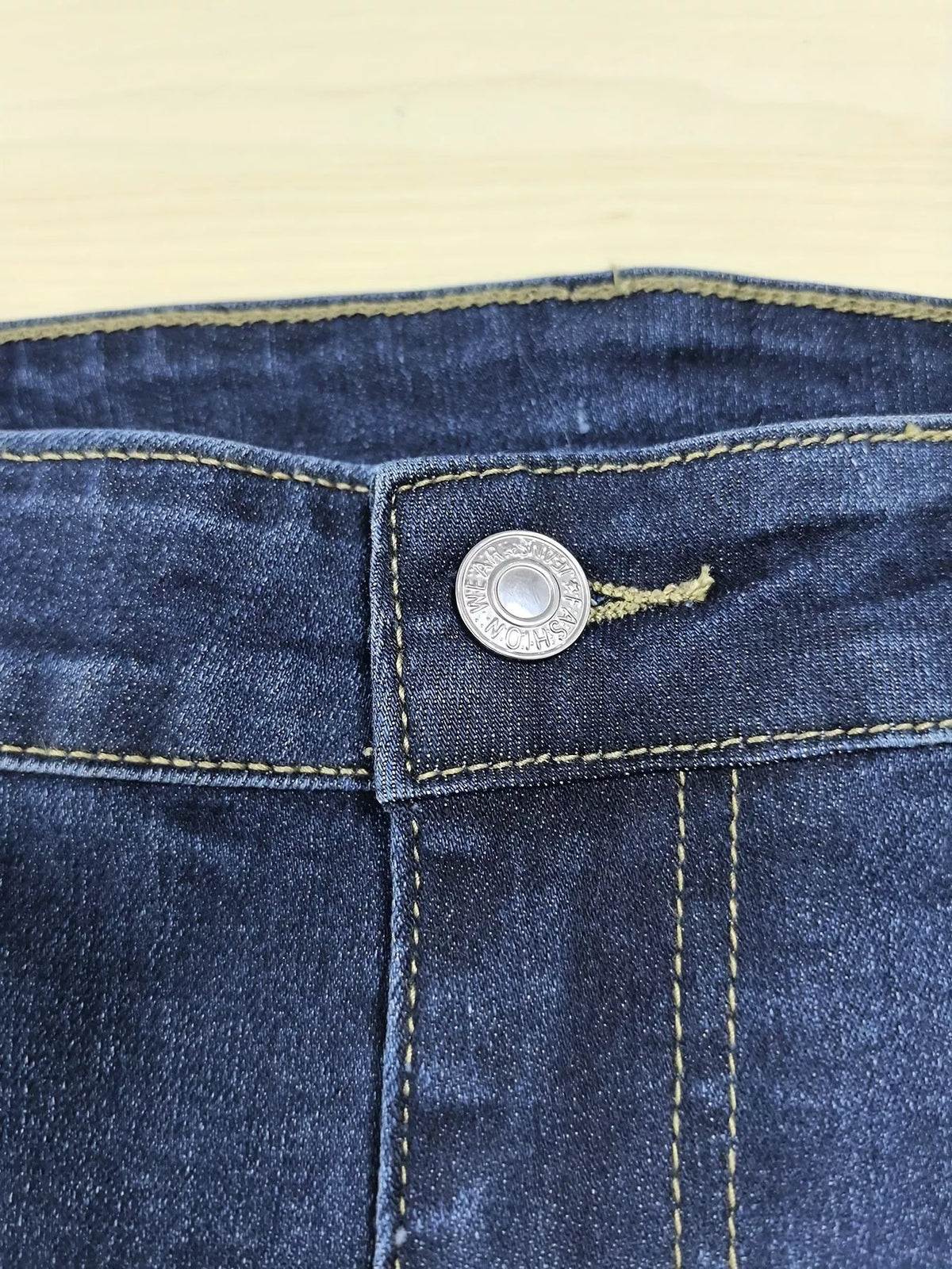 Distressed detailing on plus size slim denim