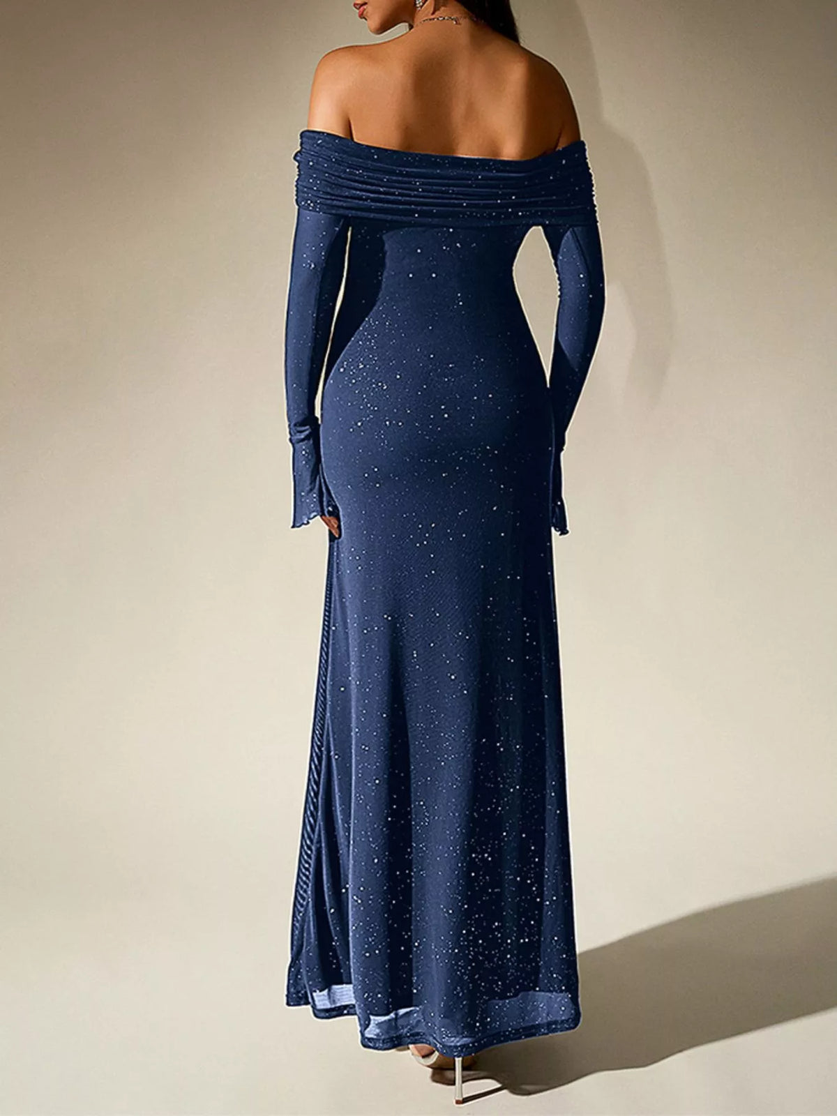 glitter off shoulder maxi dress paired with heels