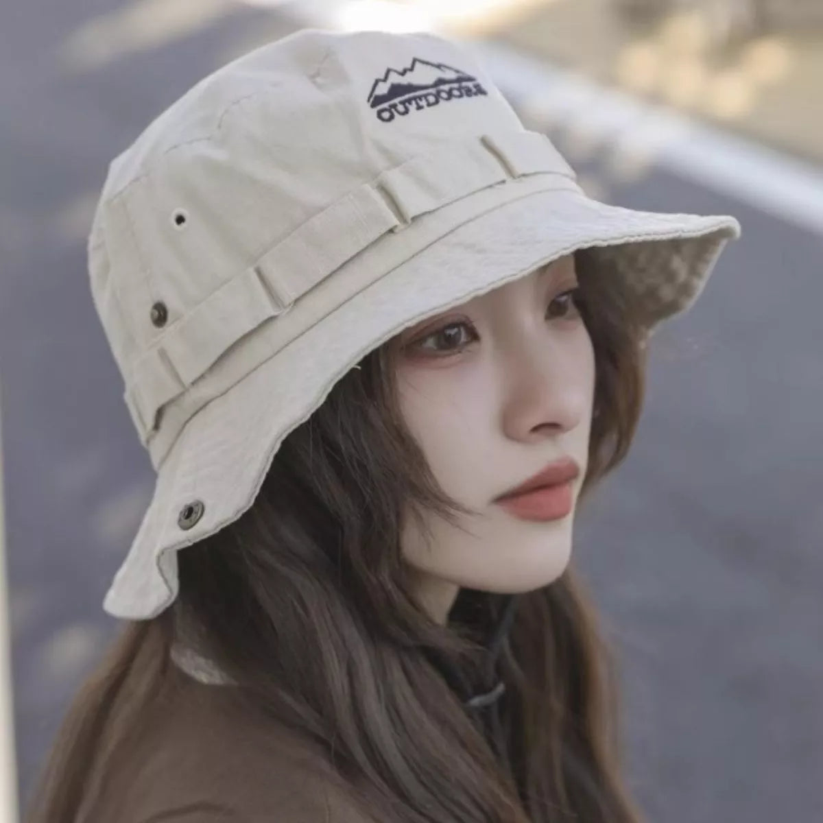 Wide brim cotton bucket hat worn on model