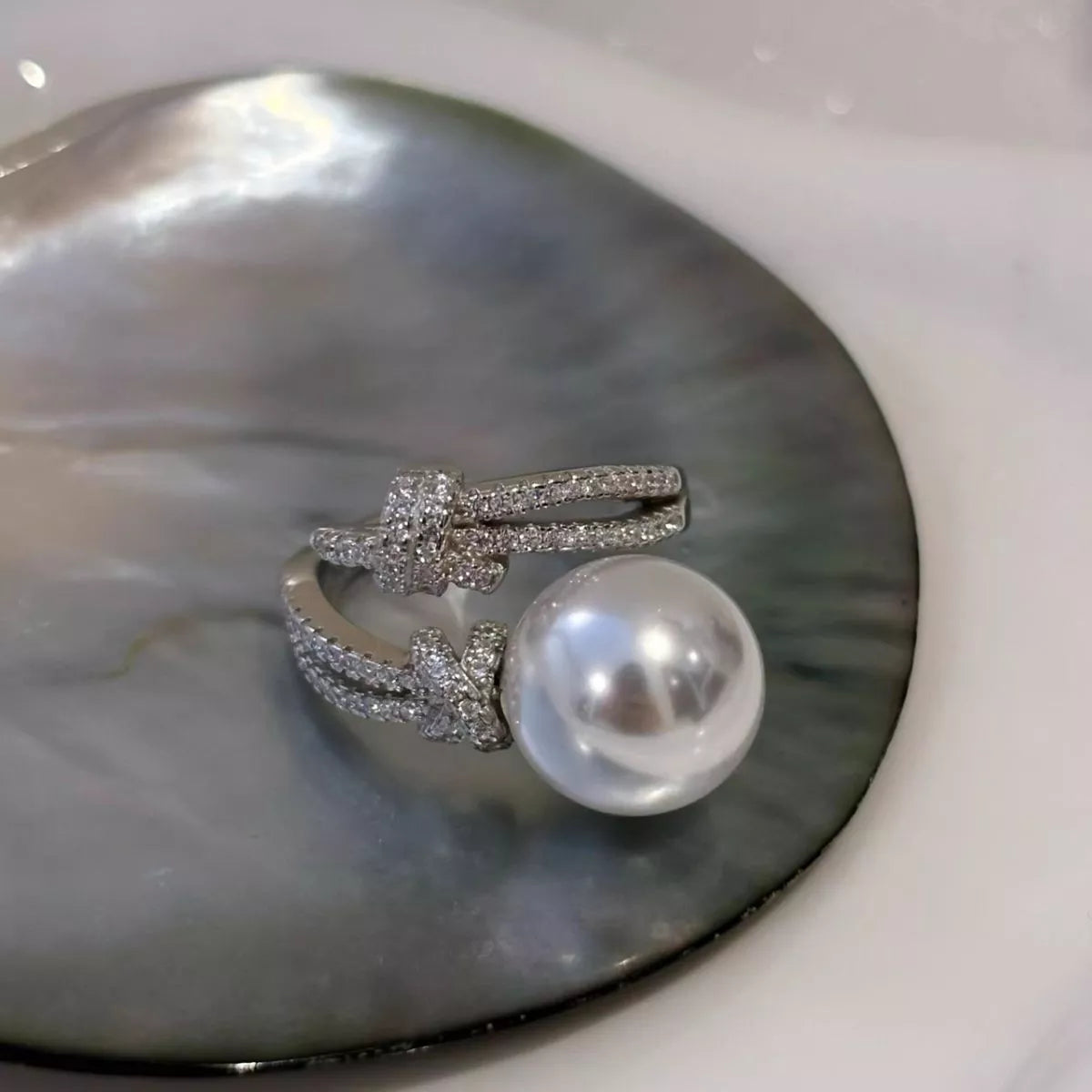 pearl and zircon bypass ring in sterling silver styled outfit