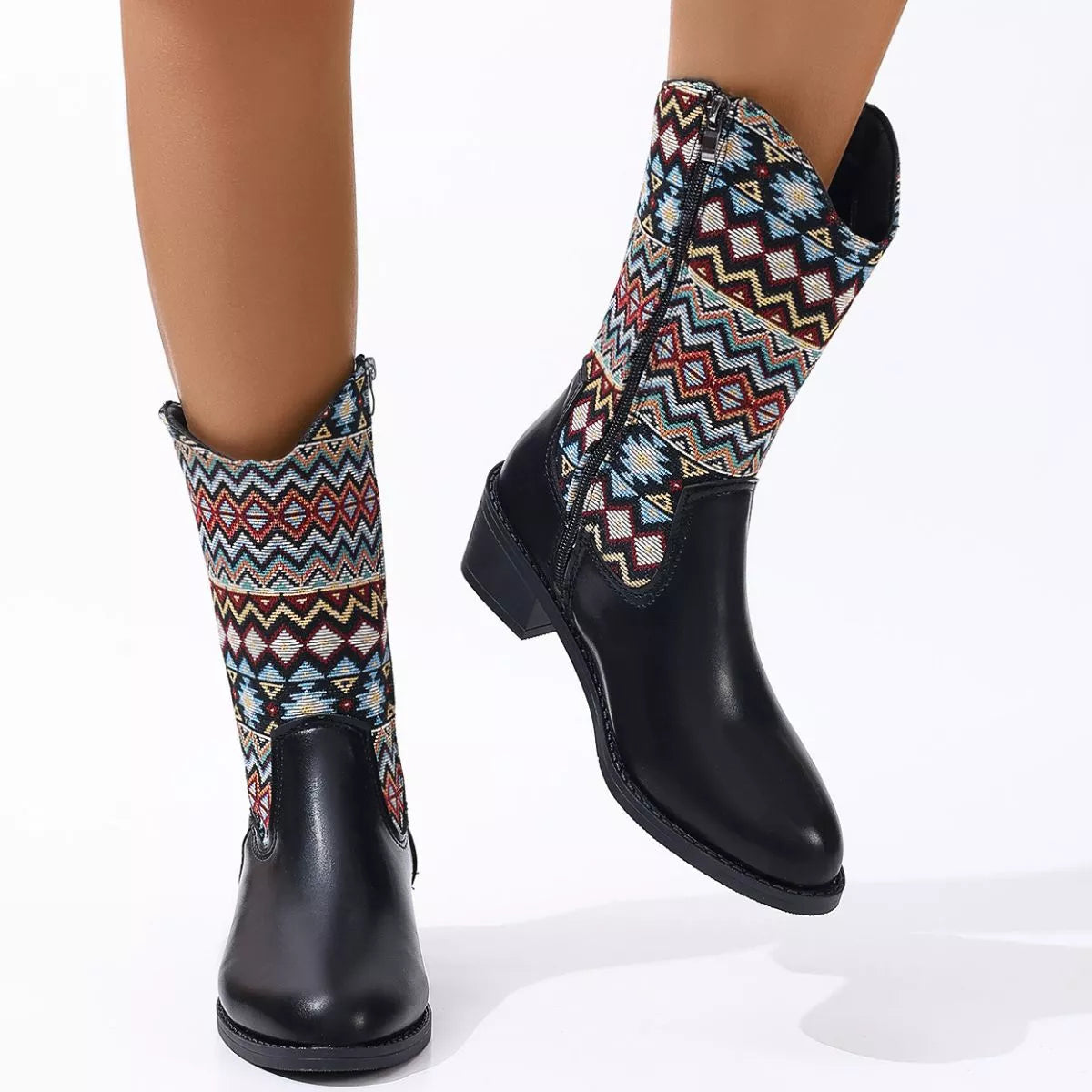 Point toe block heel boots worn on the foot