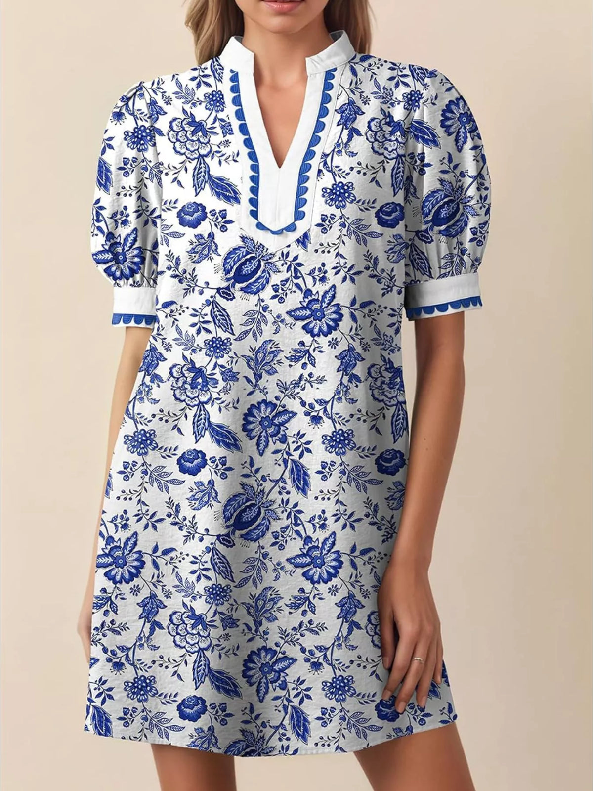 Three quarter view of the puff sleeve mini dress