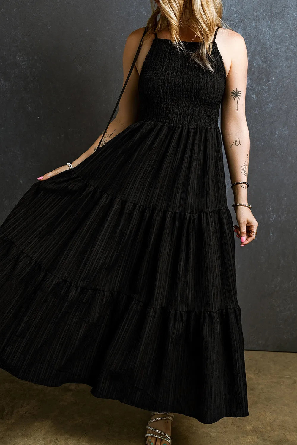 Black smocked tiered spaghetti strap maxi dress, side profile