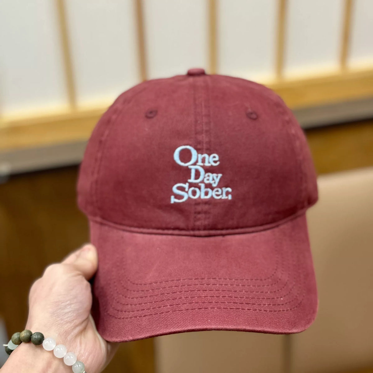 Cotton baseball cap with embroidered lettering angled view