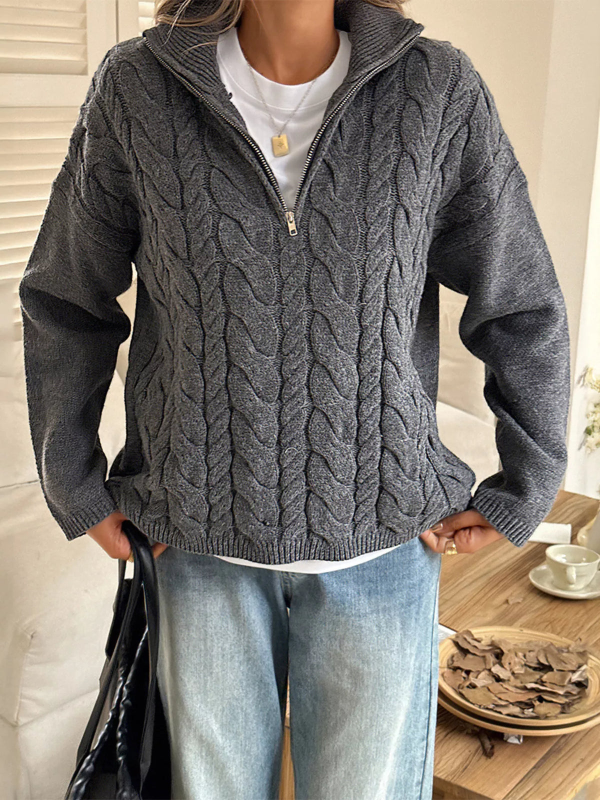 Zip collar cable knit sweater hem detail view