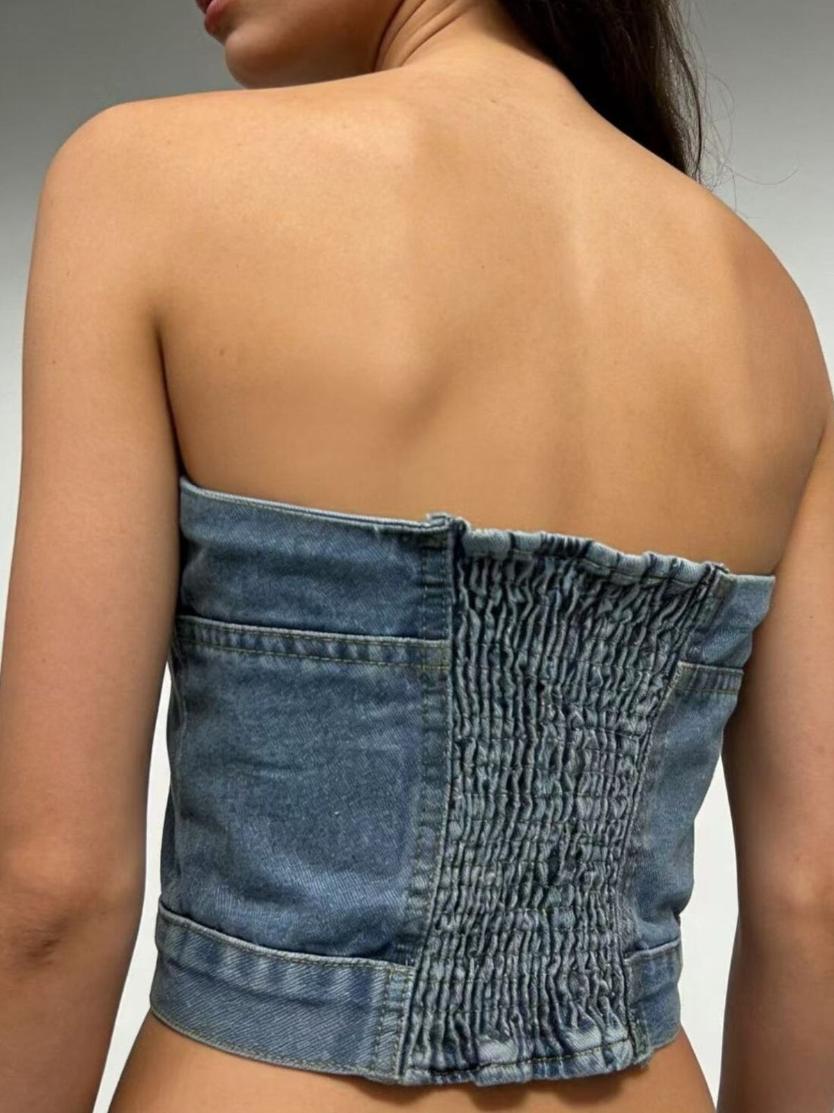 Full length styling view of the light blue denim tube top