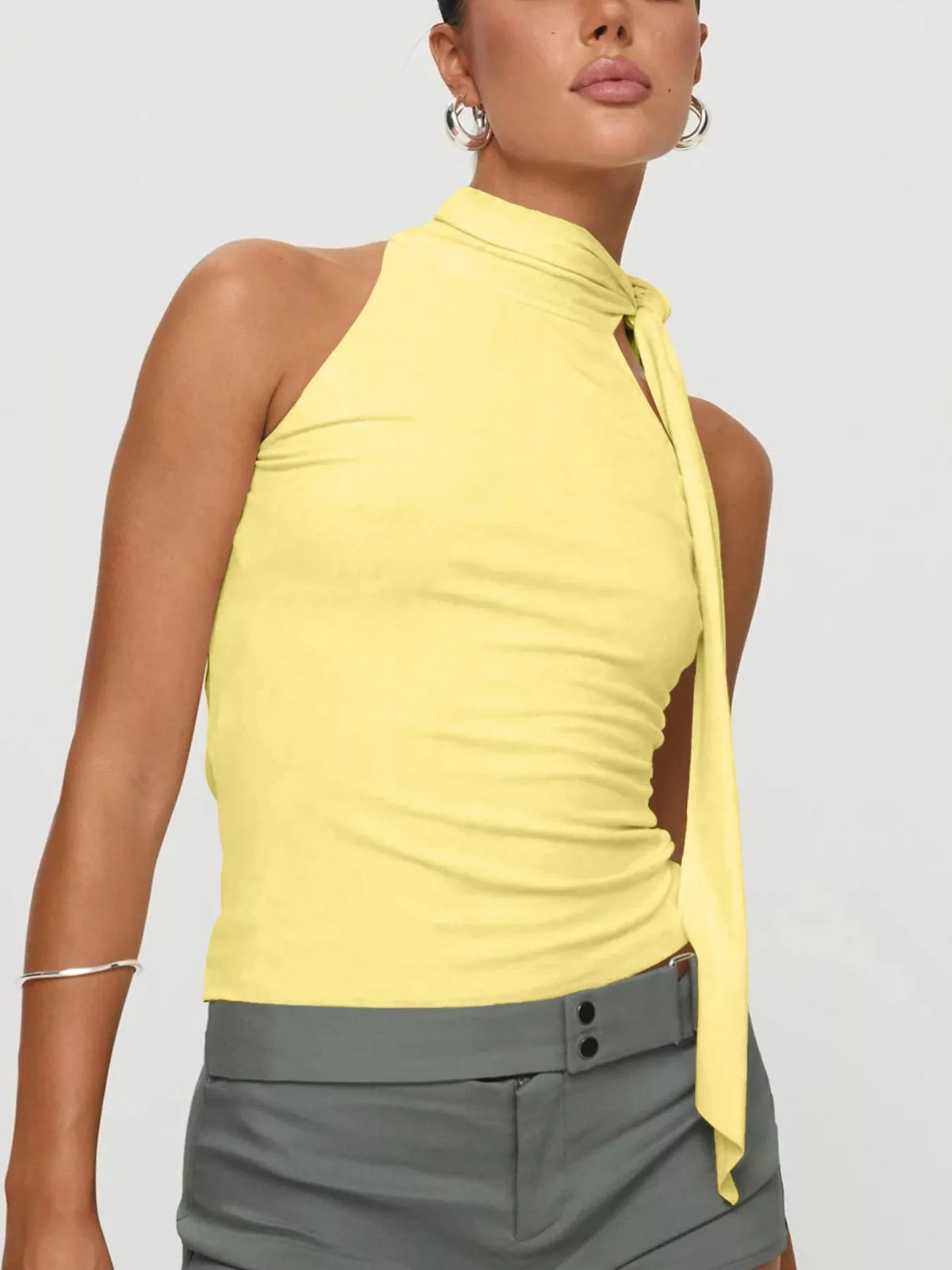 Halter top shoulder and tie detail