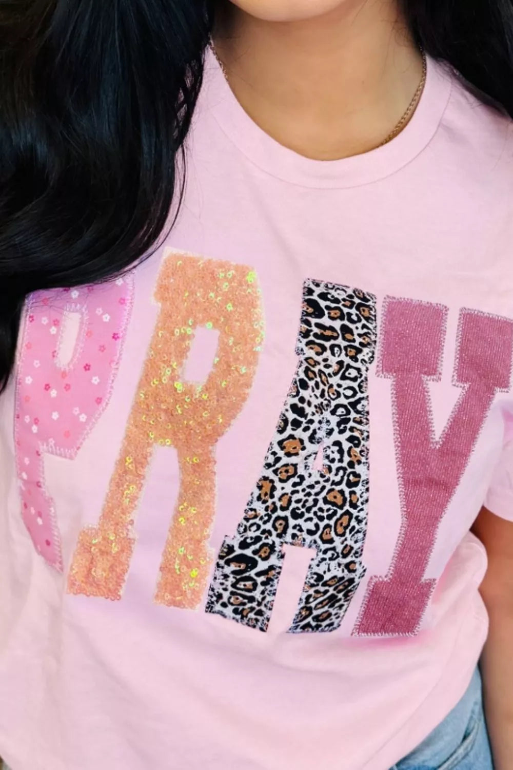 Dusty pink PRAY graphic tee styling view