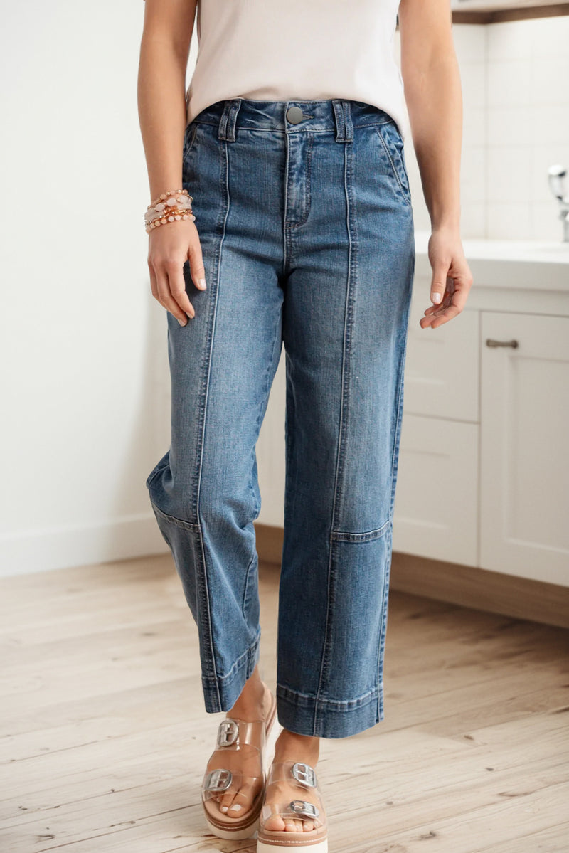 Blue exposed stitching straight leg jeans front view