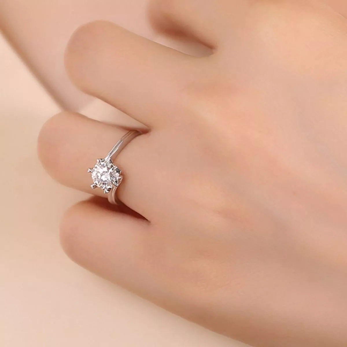 Snowflake prong setting detail on the moissanite solitaire
