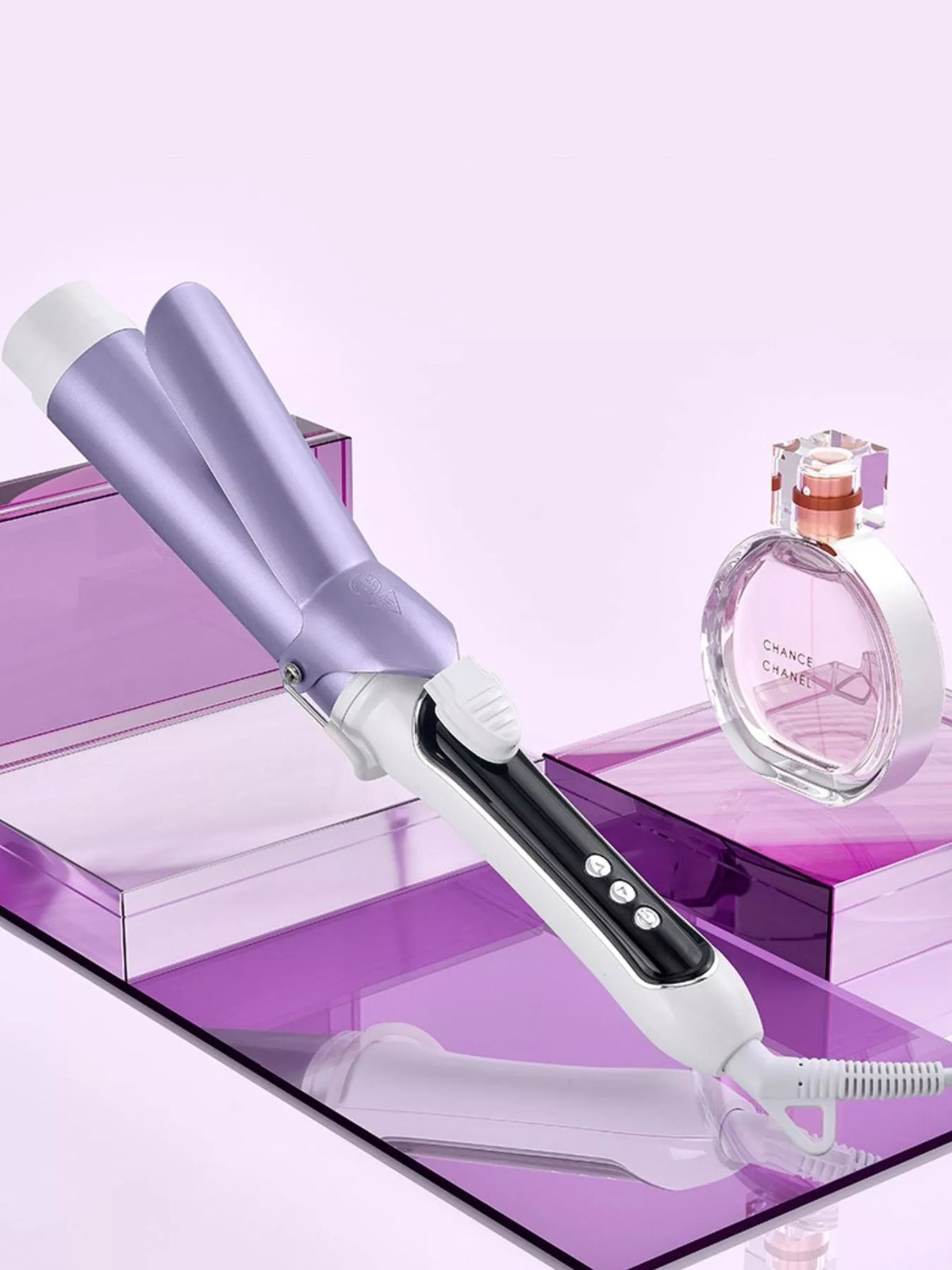 Curling iron control buttons on handle