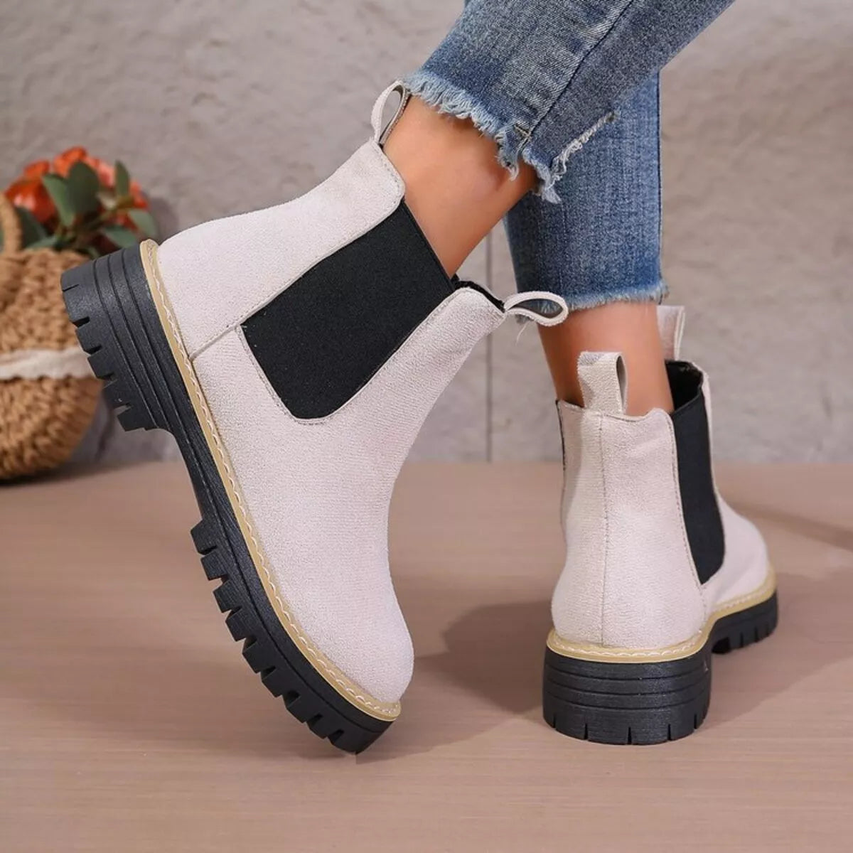 black round toe platform boots worn with denim