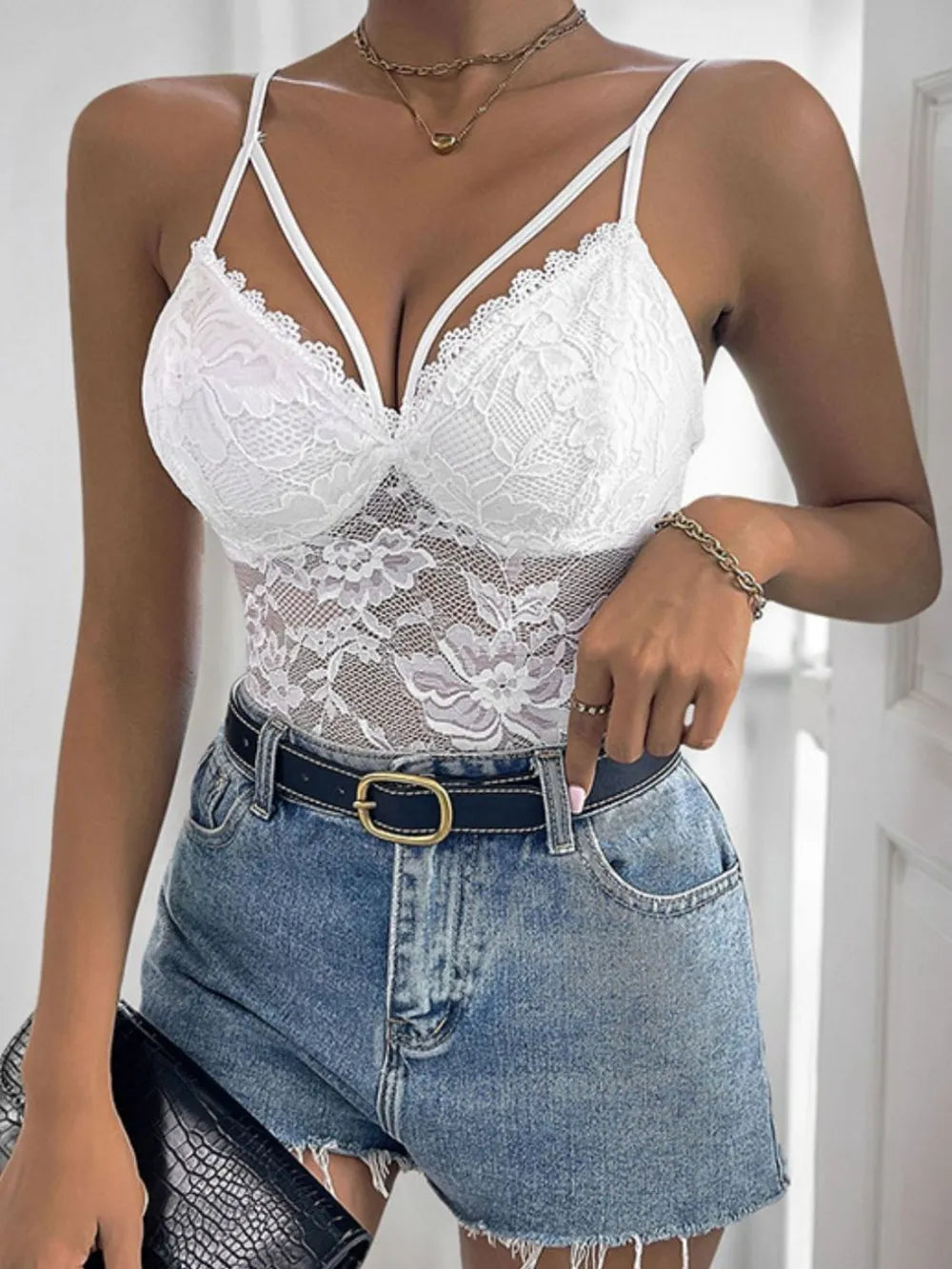 Lace bodysuit strap and neckline detail