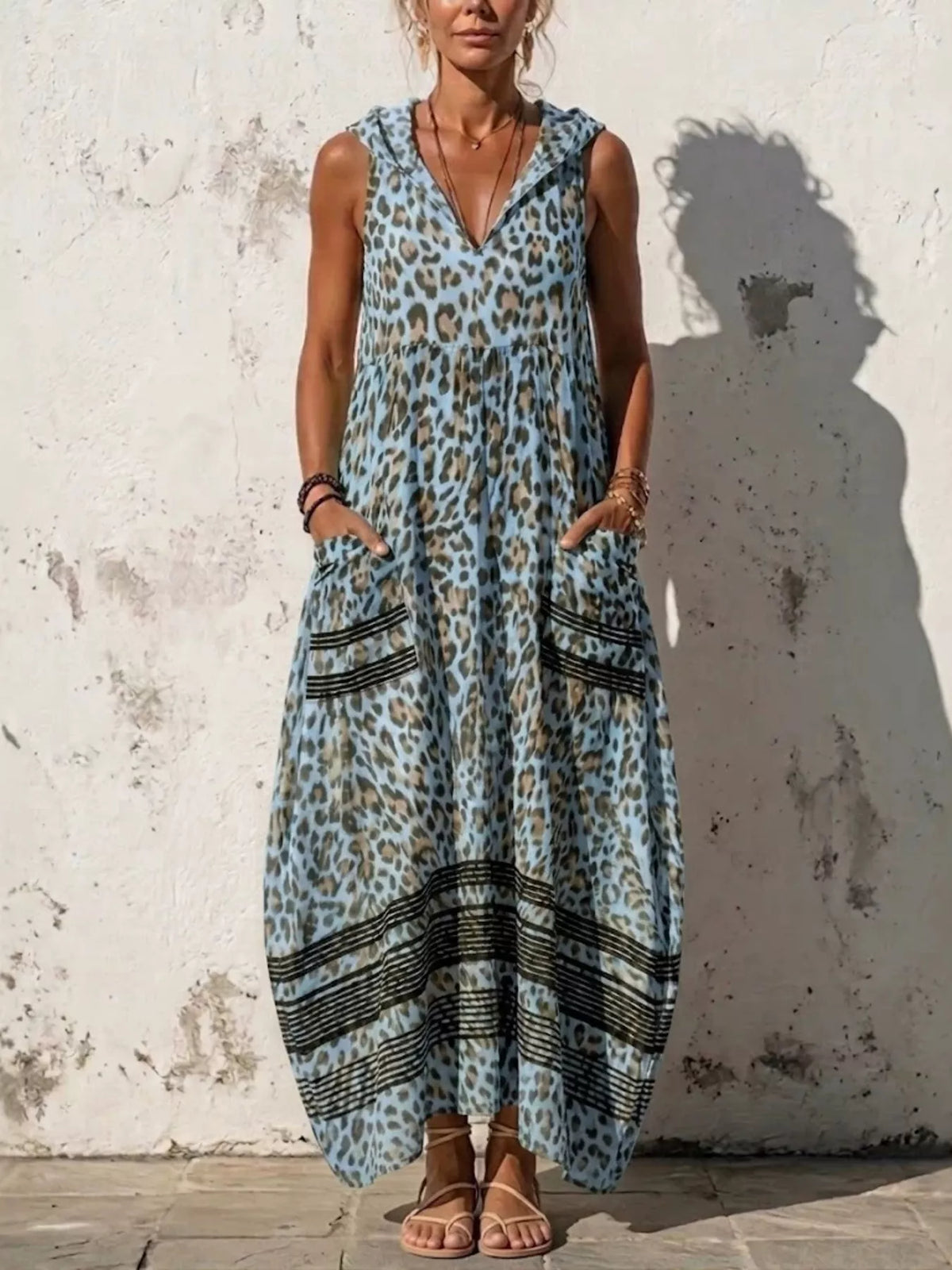 Sleeveless hooded leopard print maxi dress with pockets front view