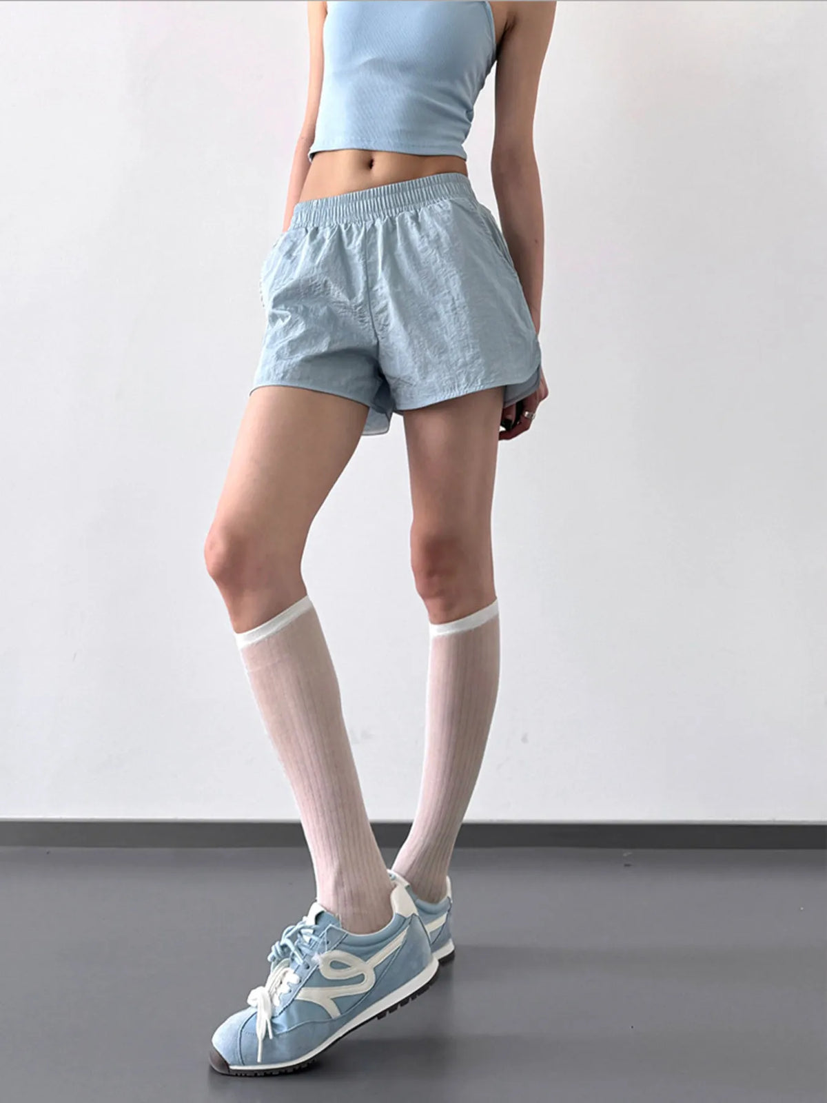 Quick dry elastic waist active shorts three quarter view
