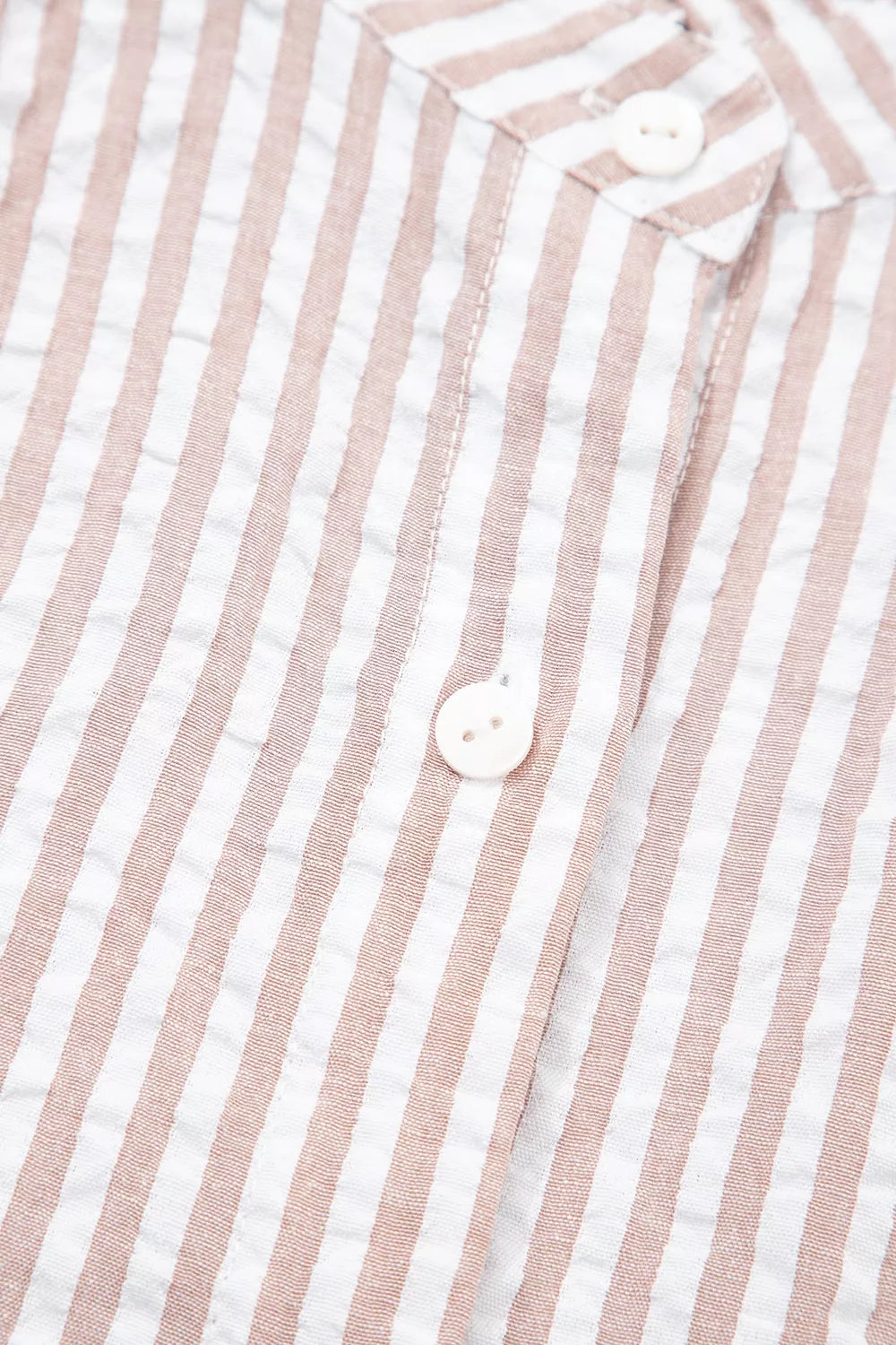 Womens striped shirt dress seated view