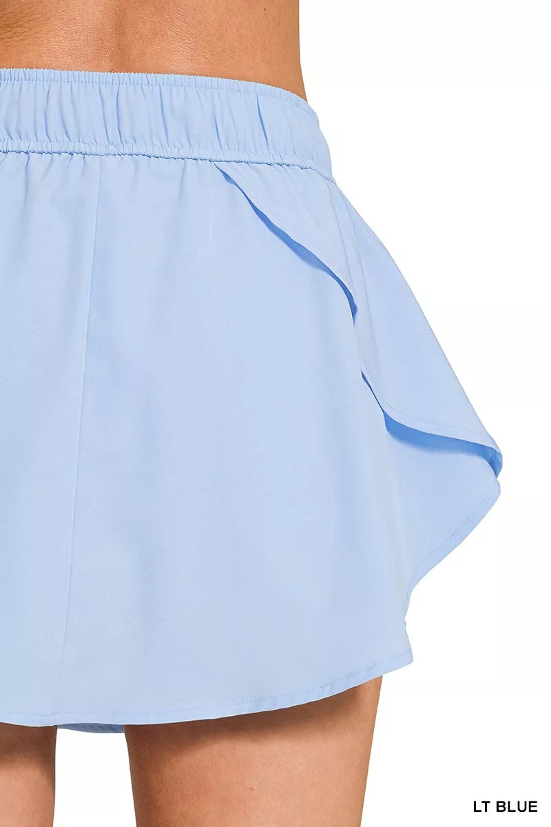 Zenana soft woven active skort with pockets in light blue styled outfit view