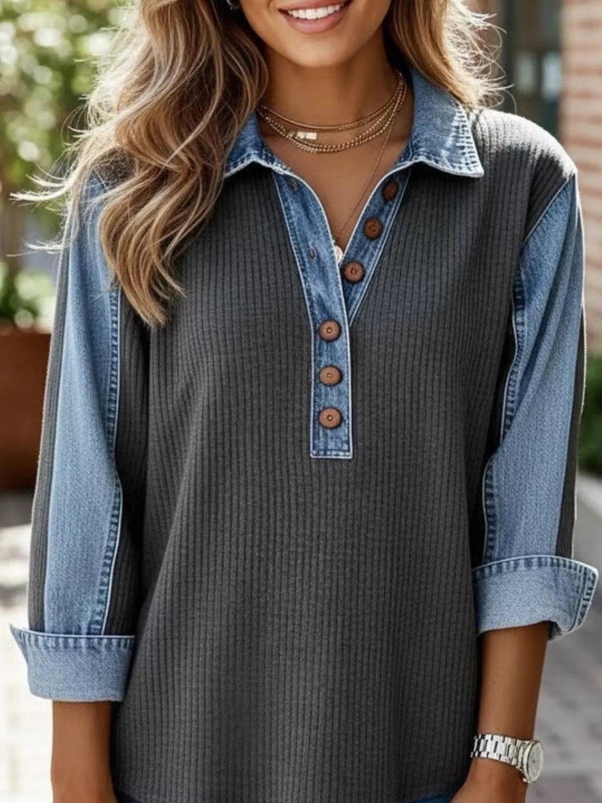 Close up of the button detailing on the sweatshirt