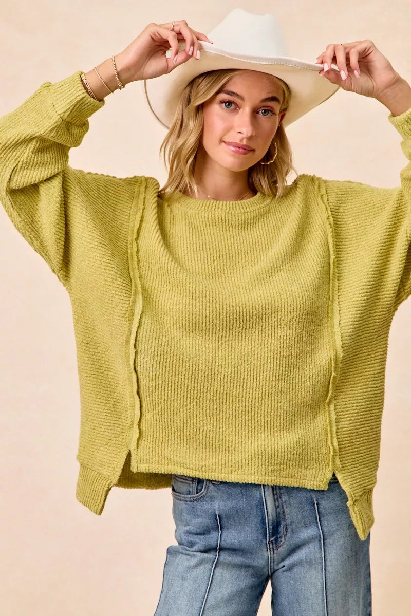 Lime green boucle rib knit uneven hem sweater front view