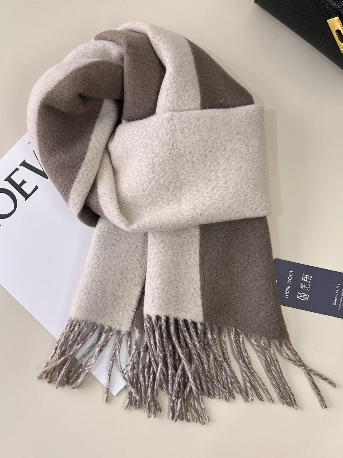 Contrasting color block tones on the wool scarf