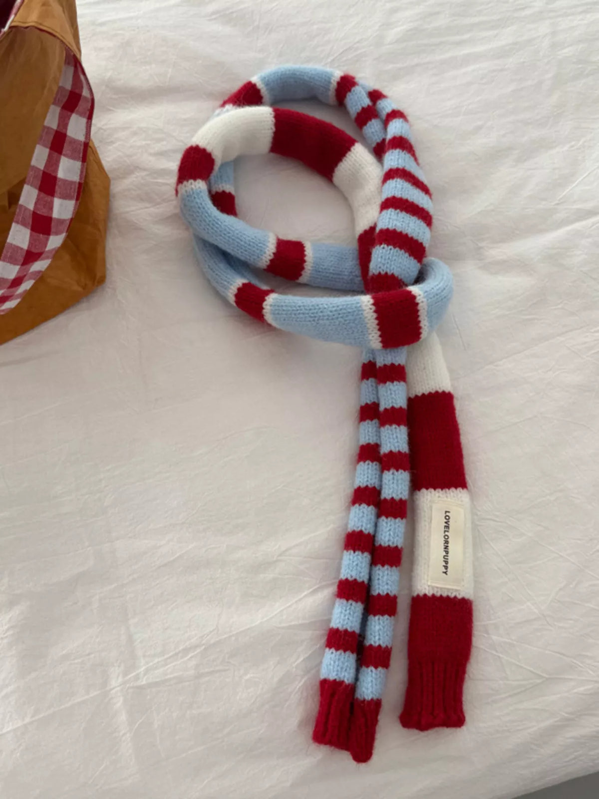 Striped knitted warm scarf wrapped around the neck