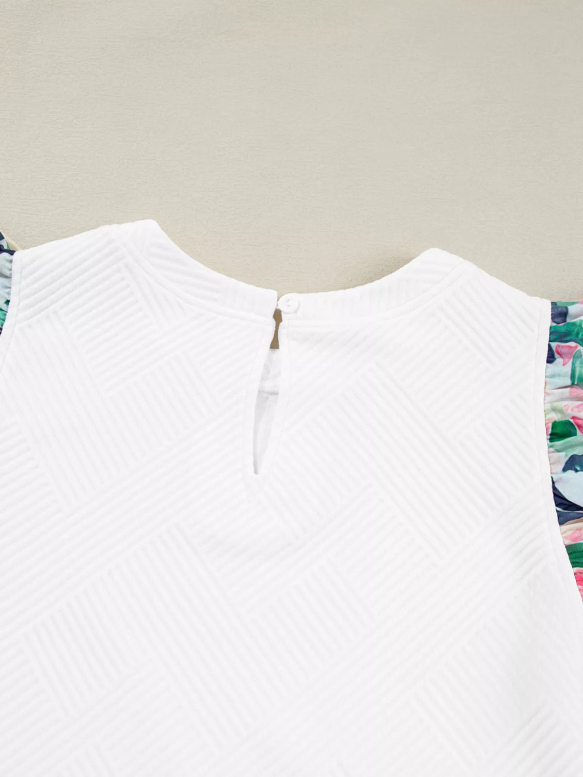 White abstract print tiered ruffle sleeve top detail view