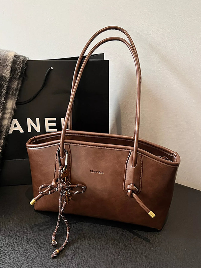 Vintage style leather shoulder bag front view