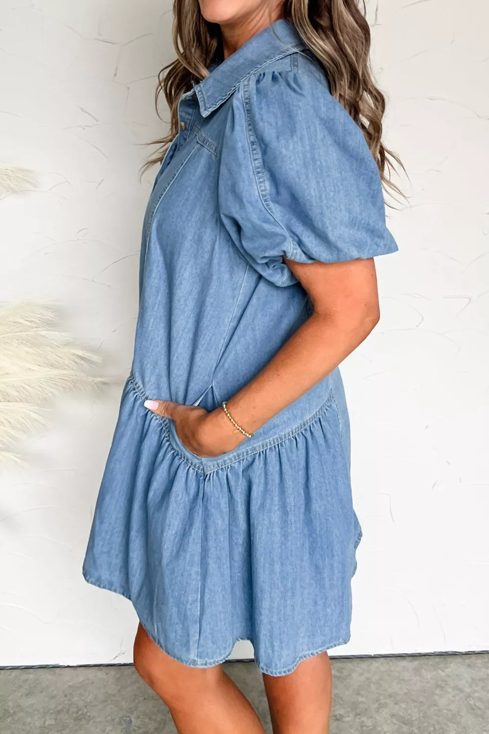 light wash puff sleeve ruffle hem denim dress three quarter view