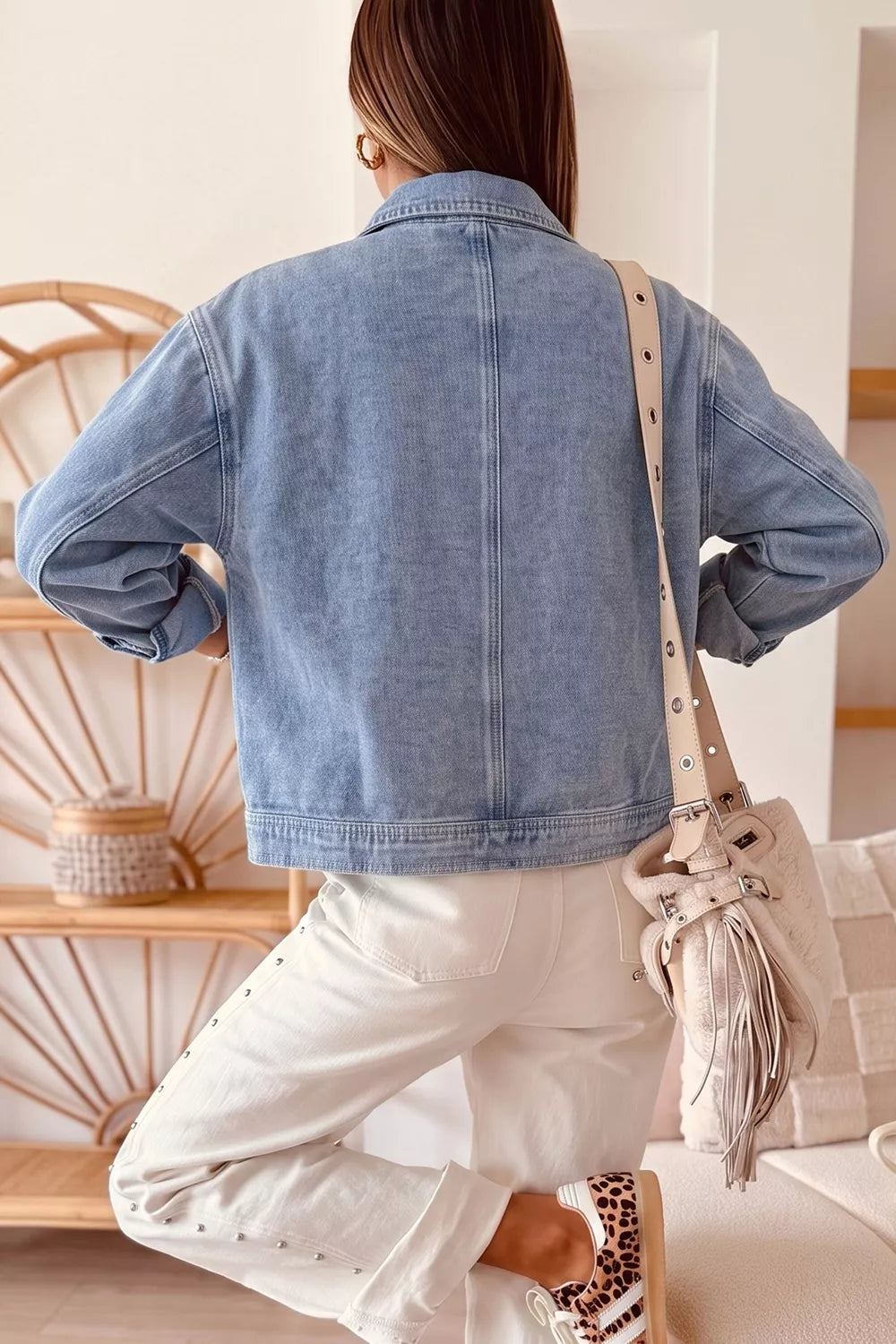 Back view of the light blue studded denim jacket