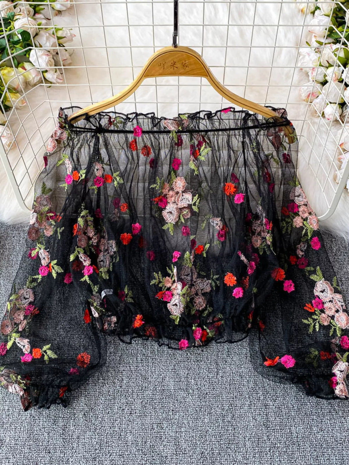 Embroidered floral sleeve close up