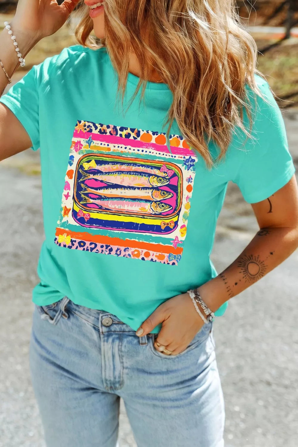 Close detail of the sardine can graphic on the tee