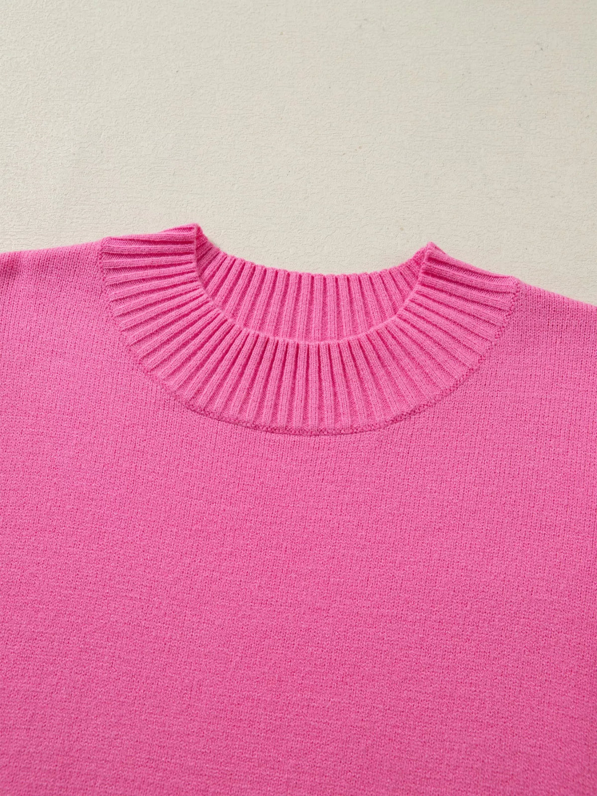 Soft pink knit sweater fabric texture