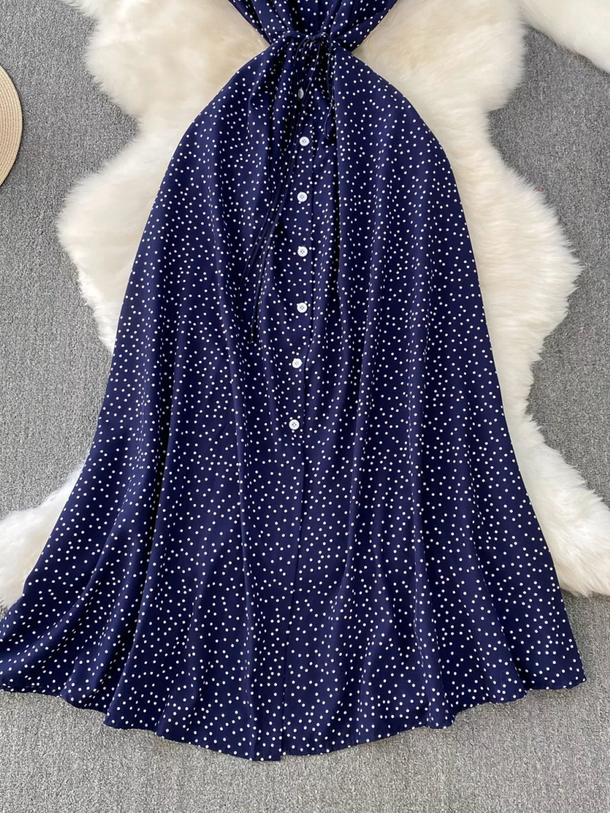 Dark blue polka dot button up maxi dress side view