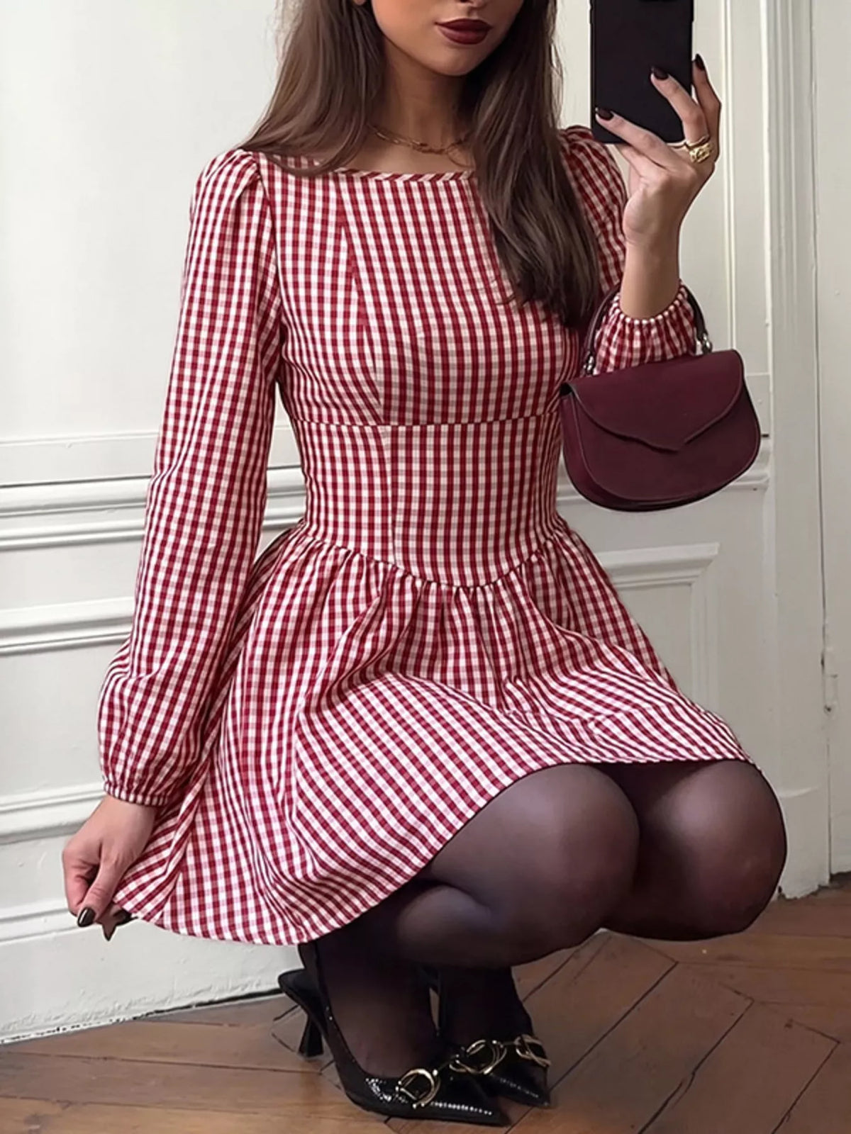 Backless plaid dress shown from the side on model