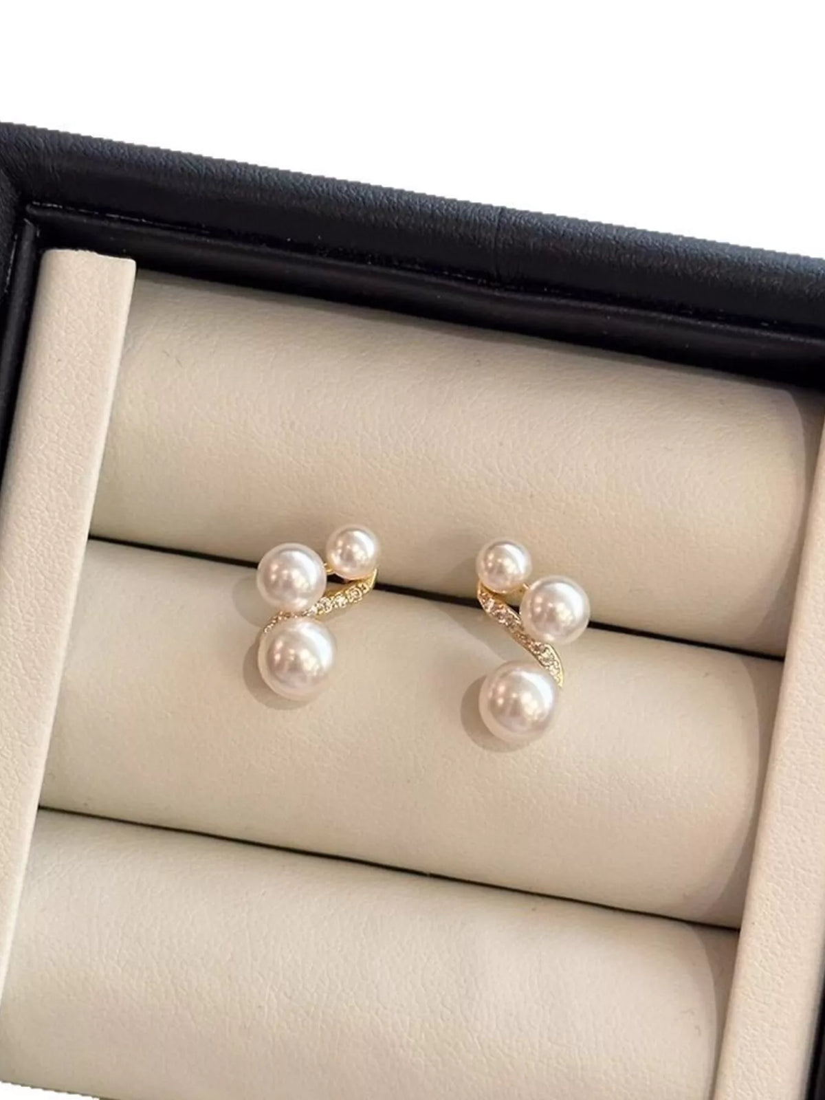 White pearl cluster stud earrings styled view