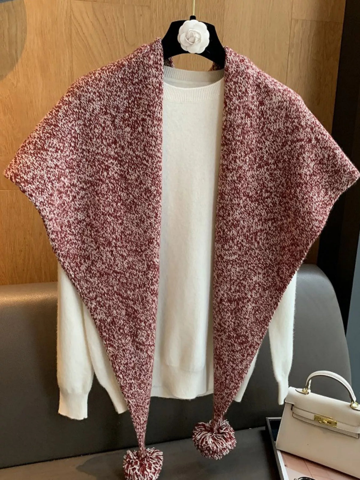 Wool pom pom scarf styled with a neutral coat