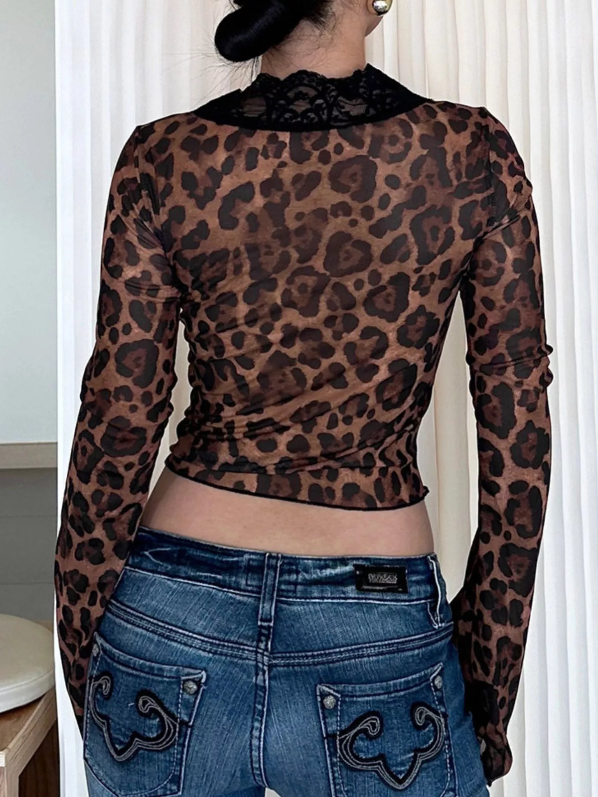 Side view of the cropped leopard print lace top