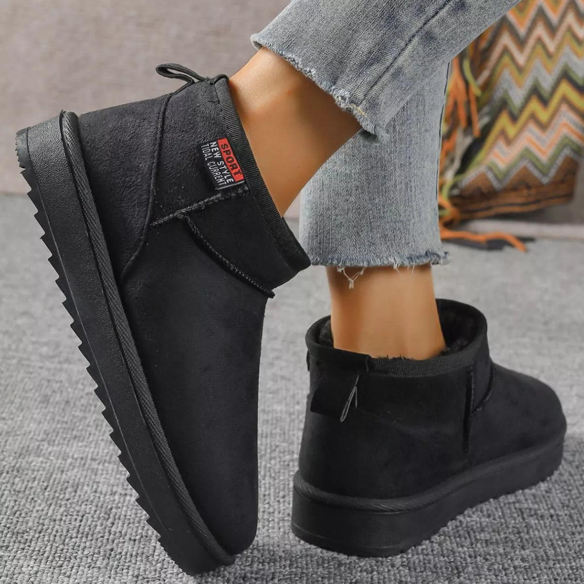 Black round toe platform boots pair standing together