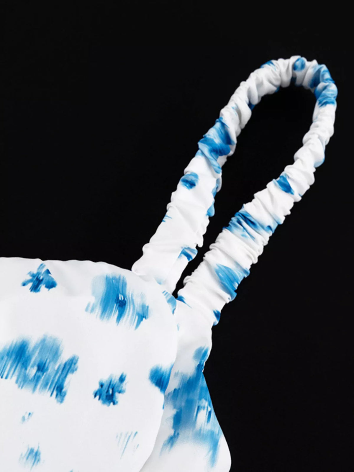 Neckline and strap detail of the tank top